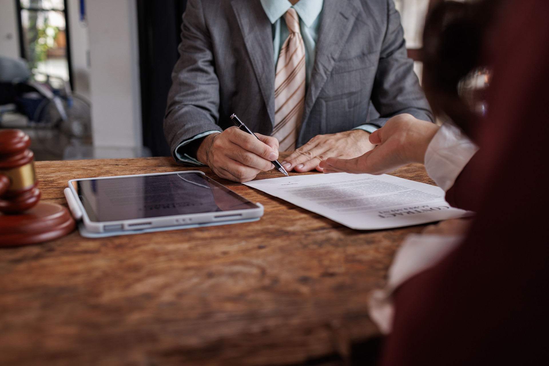 Notary with client in office,Judge gavel with Justice lawyers 
lawyer or judge counselor having team meeting with client, Law and Legal services concept.